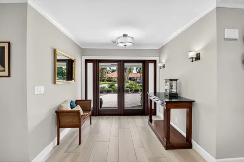 a large kitchen with a lot of counter space and a wooden floor