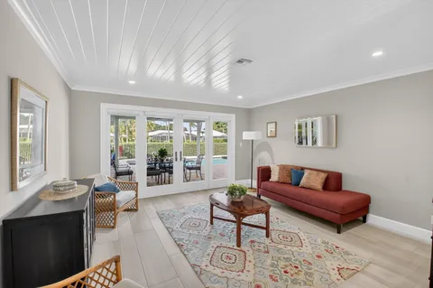 a bathroom with a granite countertop sink a toilet and a mirror