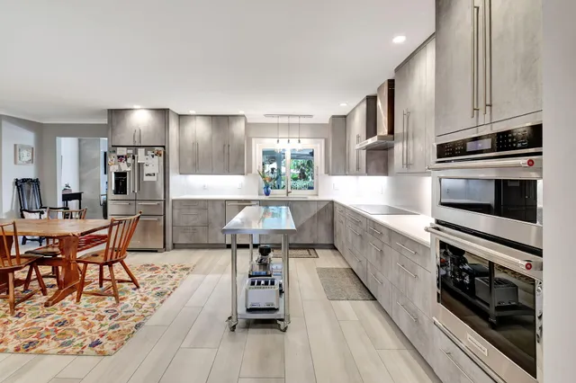 a kitchen with kitchen island granite countertop lots of counter top space