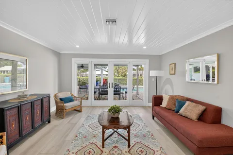 a spacious bedroom with a bed a couch and a window