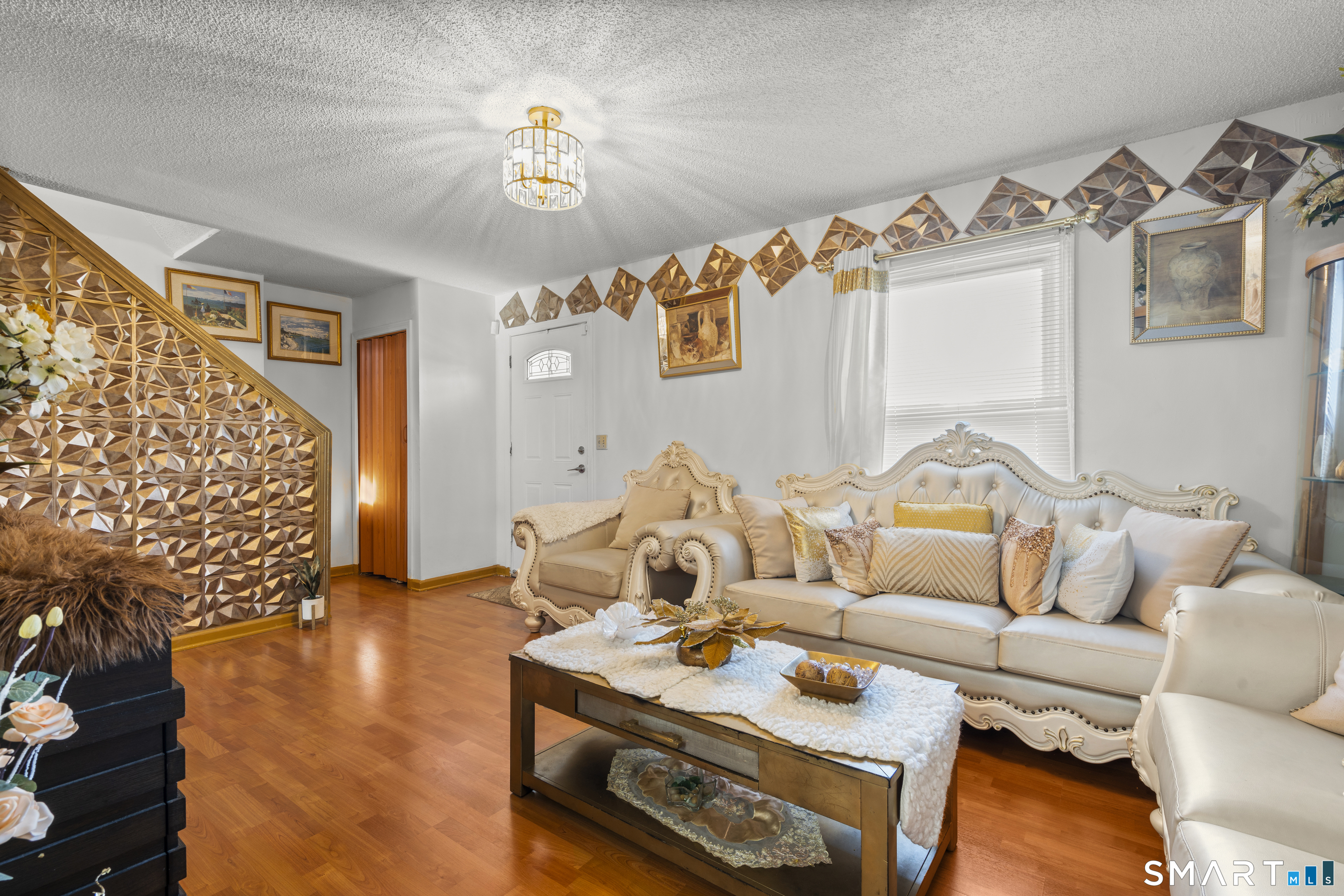 15 Kenneth Circle Waterbury, CT 06710 - Photo 11 of 31 a living room with furniture and a wooden floor