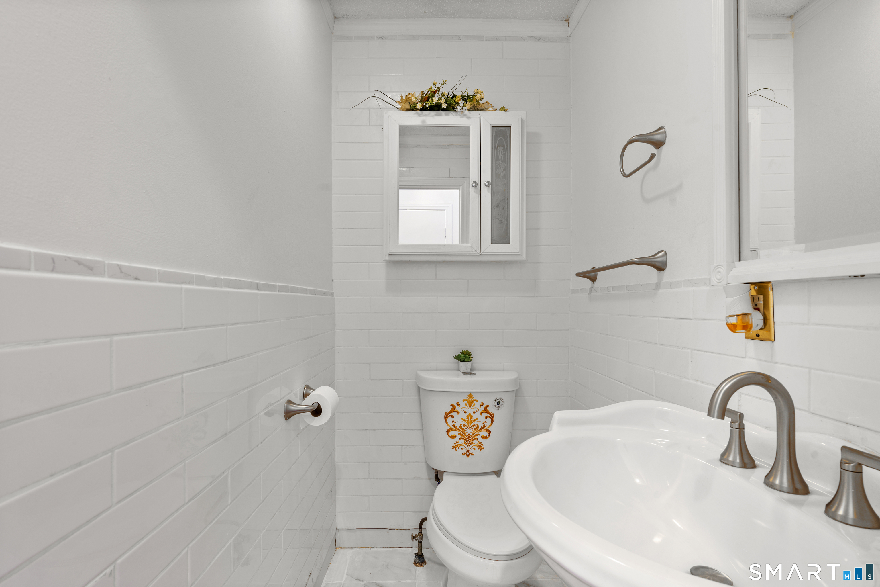15 Kenneth Circle Waterbury, CT 06710 - Photo 17 of 31 a bathroom with a sink mirror and toilet