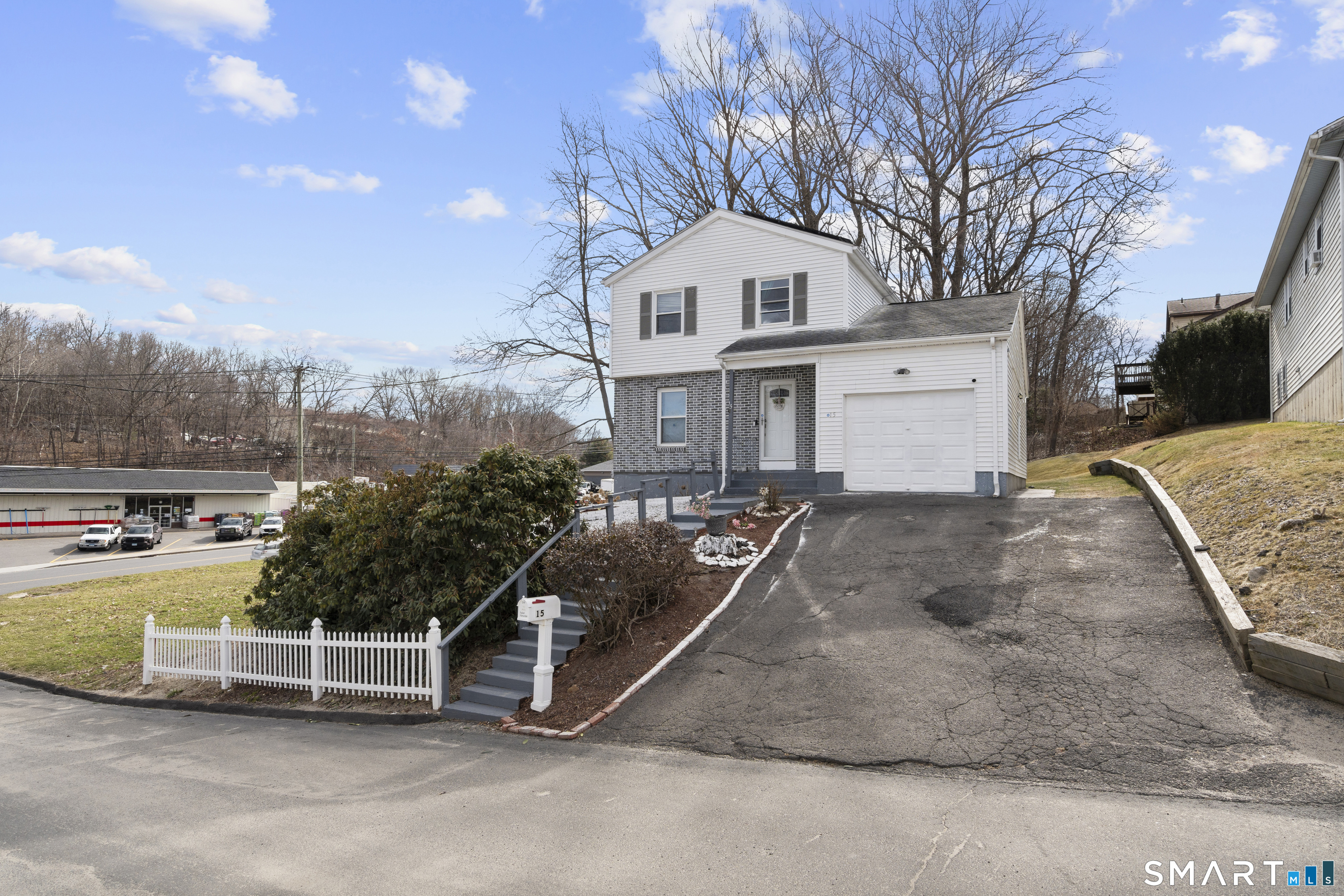 15 Kenneth Circle Waterbury, CT 06710 - Photo 2 of 31 a view of a white house with a yard