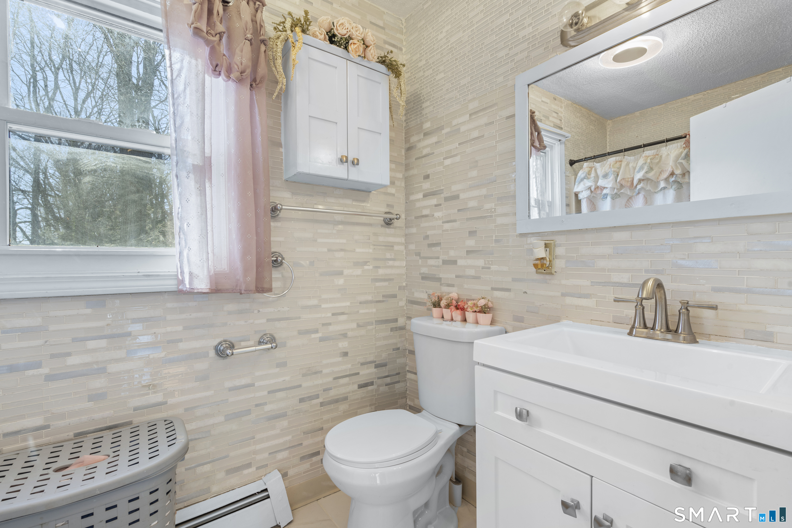 15 Kenneth Circle Waterbury, CT 06710 - Photo 21 of 31 a bathroom with a granite countertop toilet sink and mirror