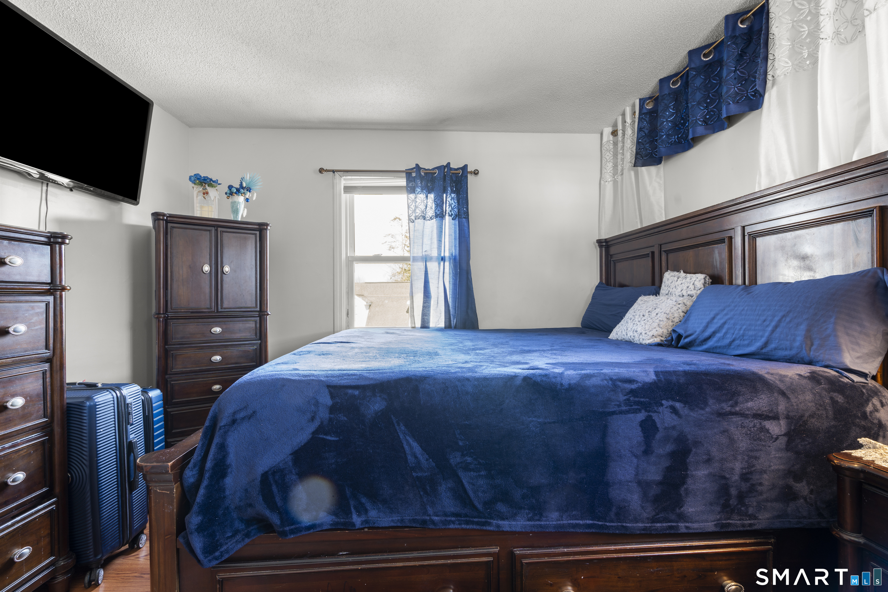 15 Kenneth Circle Waterbury, CT 06710 - Photo 25 of 31 a bedroom with a bed and a flat screen tv