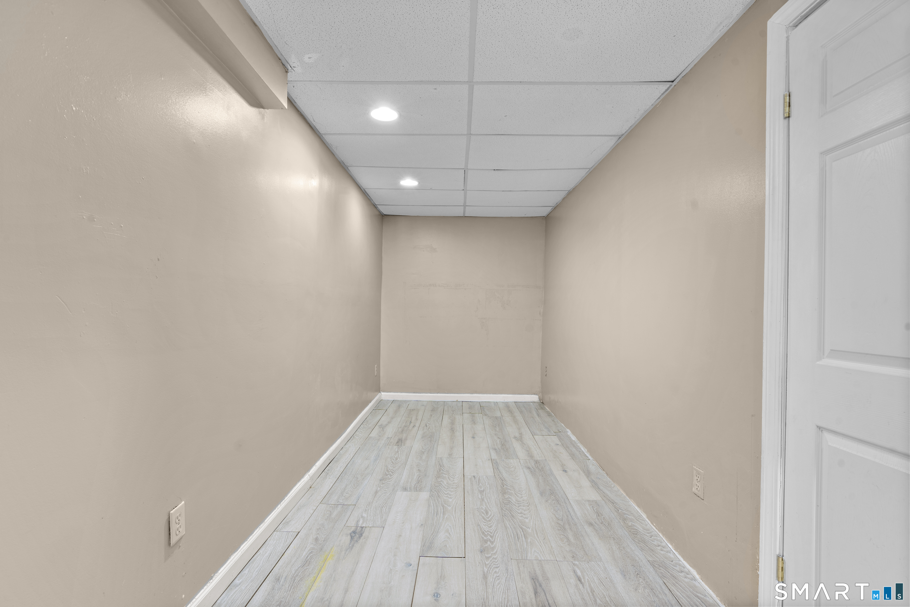 15 Kenneth Circle Waterbury, CT 06710 - Photo 27 of 31 a view of empty room with wooden floor