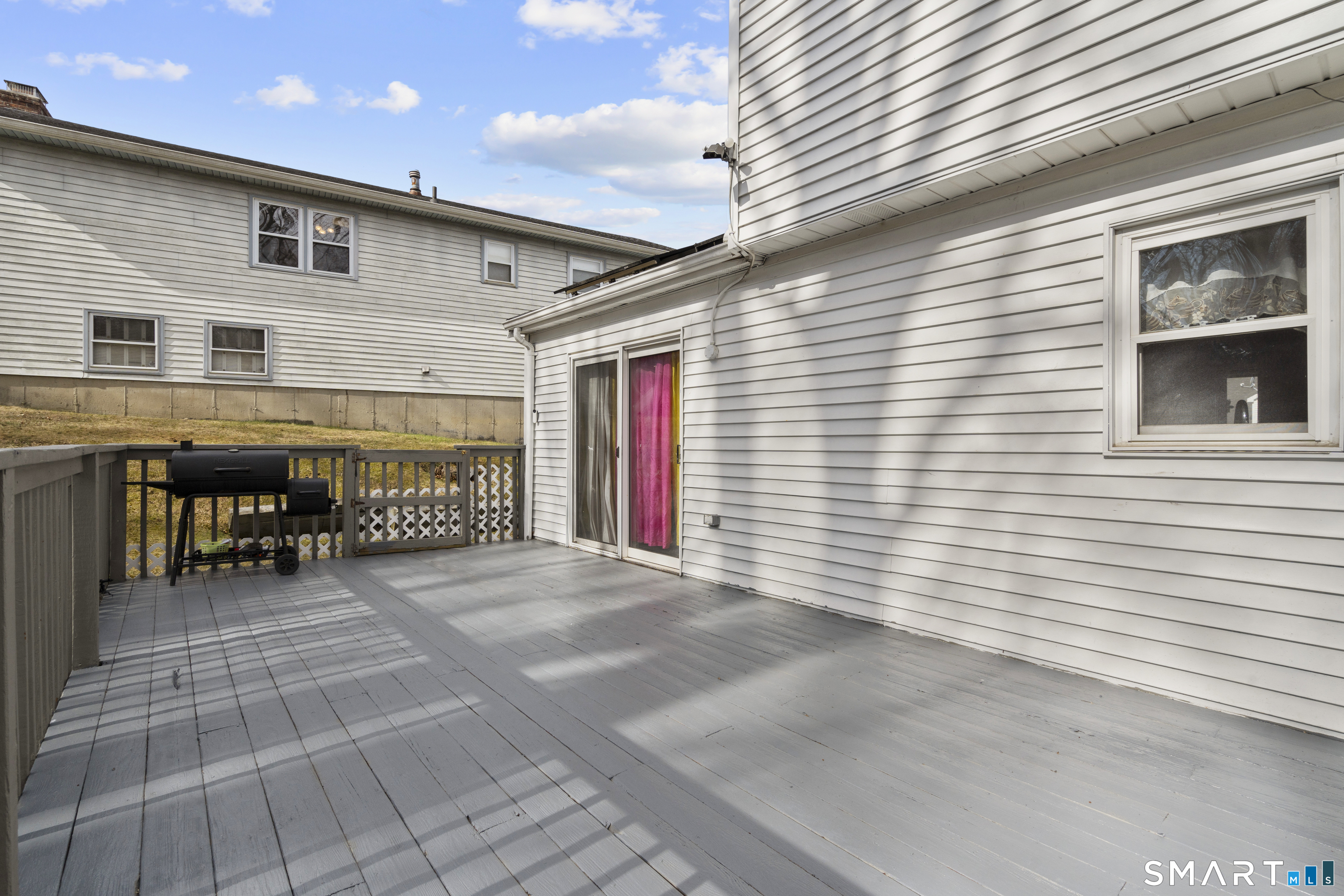 15 Kenneth Circle Waterbury, CT 06710 - Photo 30 of 31 a view of a porch with a table and chairs
