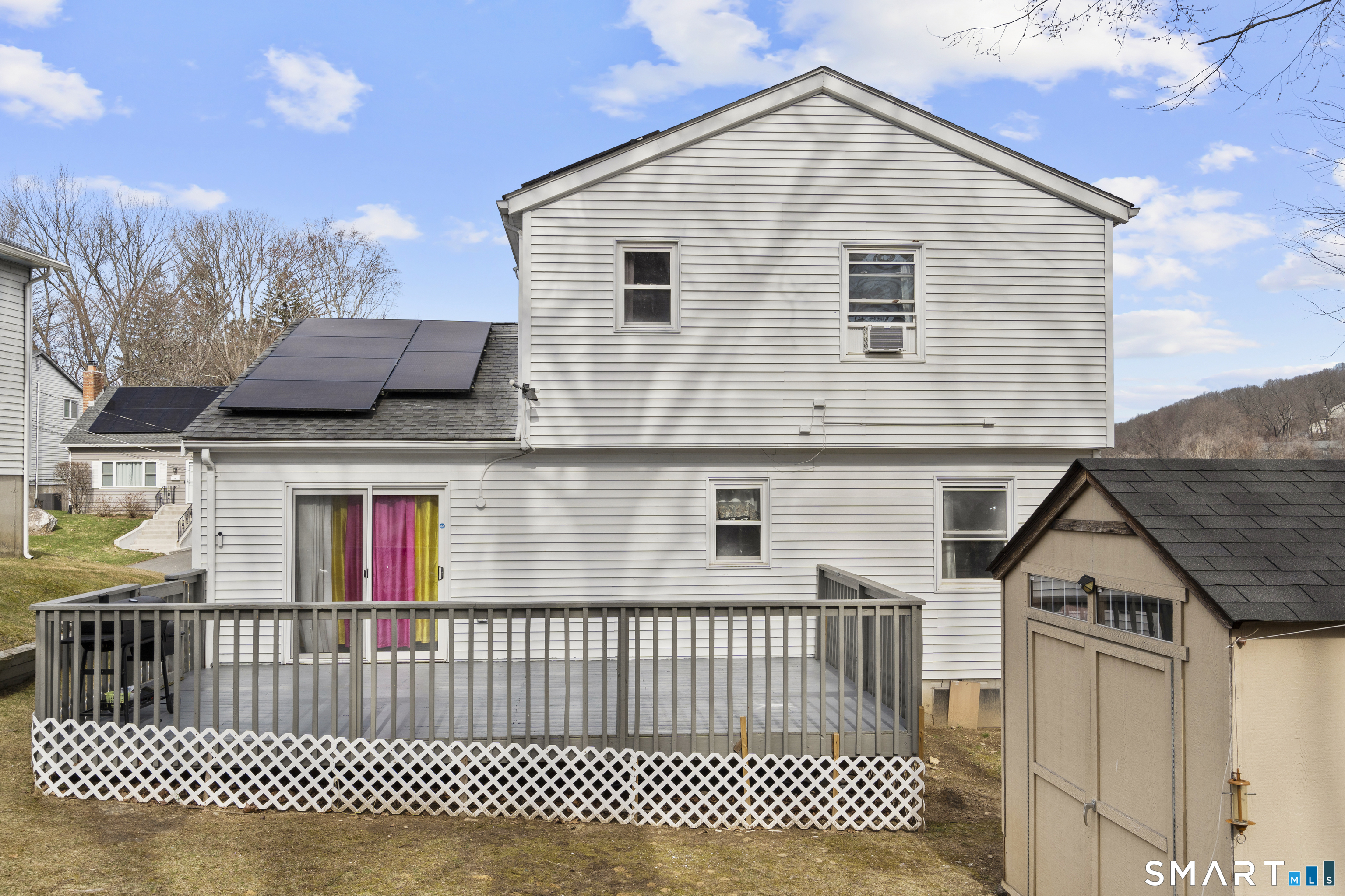 15 Kenneth Circle Waterbury, CT 06710 - Photo 7 of 31 a view of a house with wooden fence