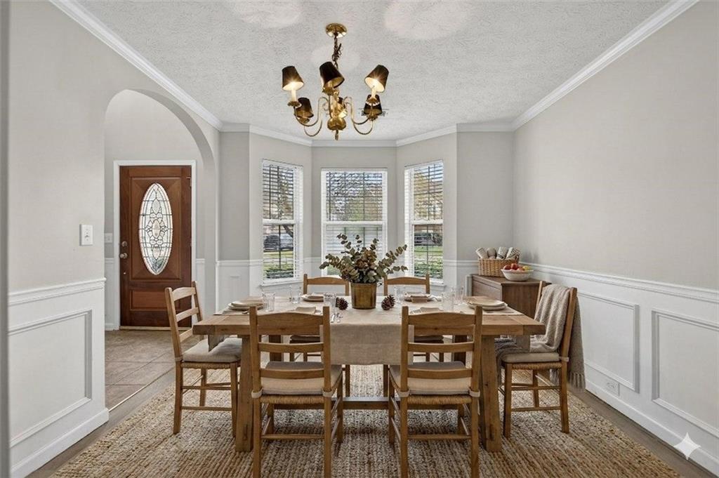 45 Polo Fields Northeast Cartersville, GA 30121 - Photo 11 of 49 a view of a dining room with furniture a chandelier and wooden floor