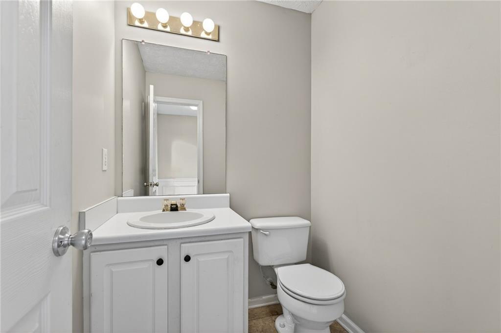 45 Polo Fields Northeast Cartersville, GA 30121 - Photo 20 of 49 a bathroom with a toilet a sink and a mirror