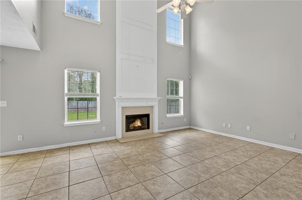 45 Polo Fields Northeast Cartersville, GA 30121 - Photo 22 of 49 a view of an empty room with a fireplace and a window