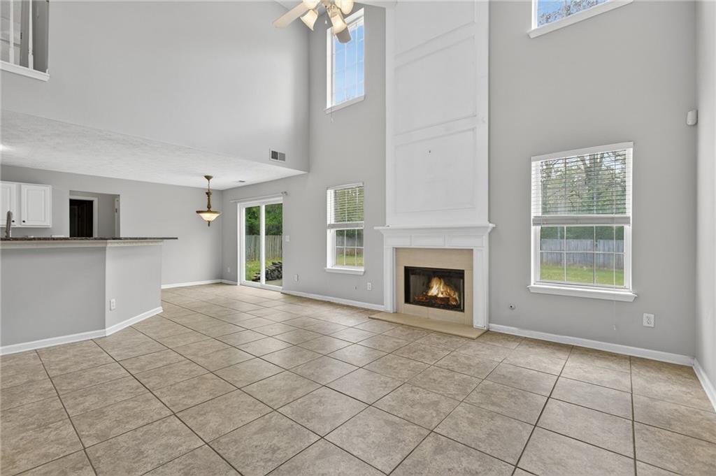 45 Polo Fields Northeast Cartersville, GA 30121 - Photo 23 of 49 a view of a livingroom with a fireplace cabinet and windows