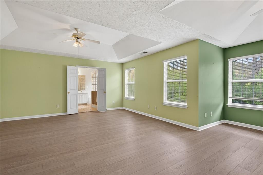 45 Polo Fields Northeast Cartersville, GA 30121 - Photo 30 of 49 a view of an empty room with a window and wooden floor