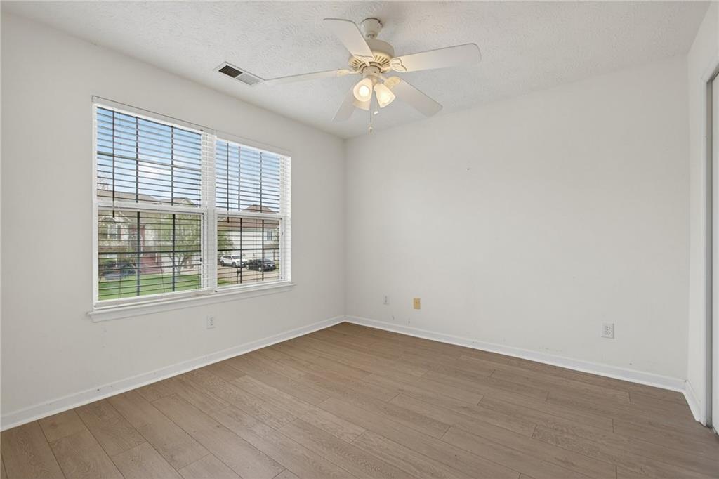 45 Polo Fields Northeast Cartersville, GA 30121 - Photo 38 of 49 an empty room with a window and a fan
