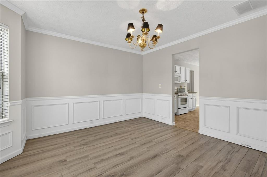 45 Polo Fields Northeast Cartersville, GA 30121 - Photo 10 of 49 a view of an empty room with wooden floor