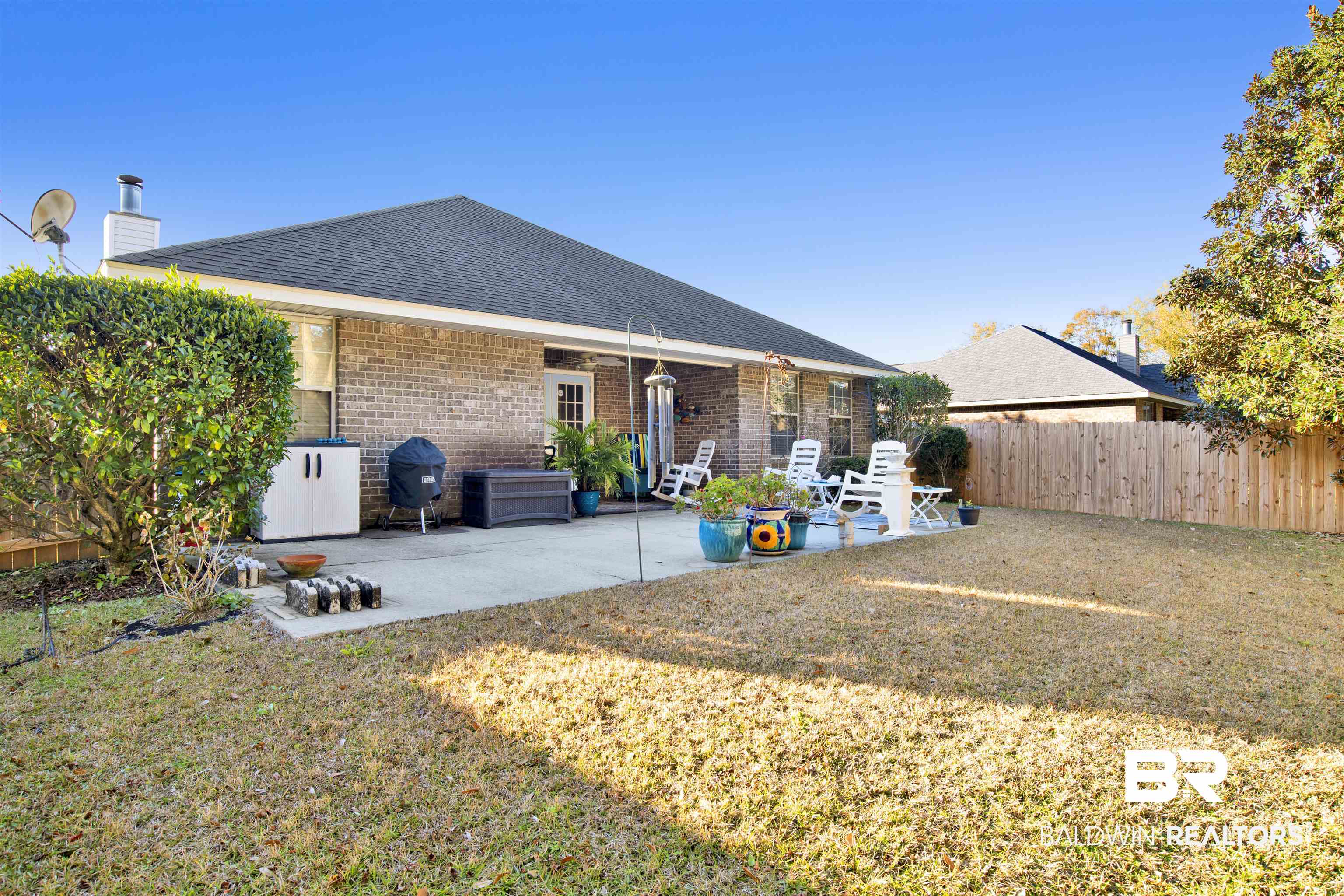 314 Blackfriars Street Fairhope, AL 36532 - Photo 24 of 25 Rear view of house with a patio and a lawn