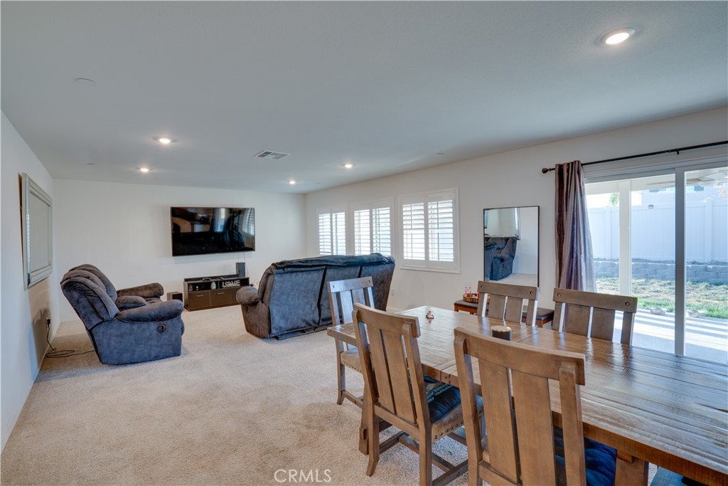 1328 Prosperity Place Hemet, CA 92543 - Photo 15 of 40 a living room with furniture a flat screen tv and wooden floor