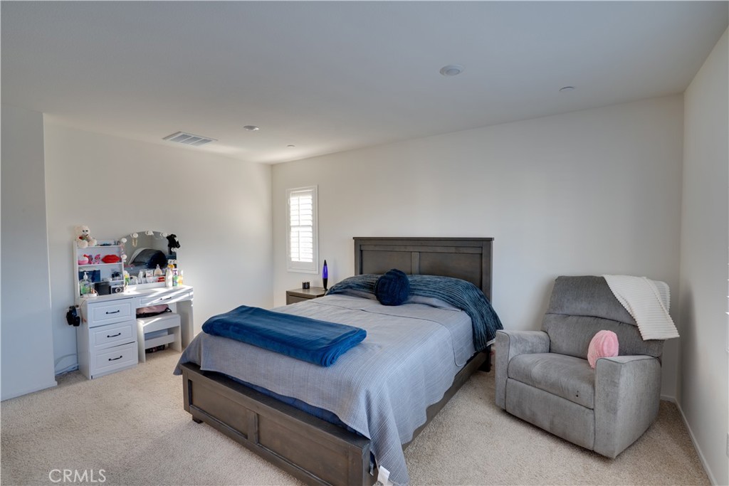 1328 Prosperity Place Hemet, CA 92543 - Photo 20 of 40 a bedroom with a bed and a closet