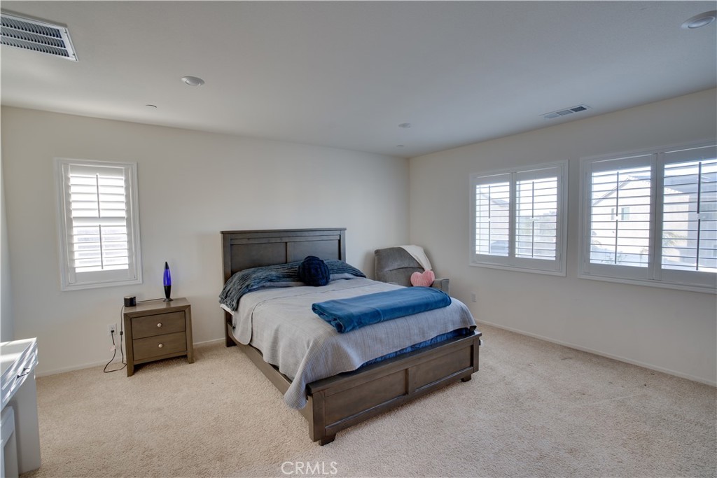 1328 Prosperity Place Hemet, CA 92543 - Photo 21 of 40 a bed sitting in a bedroom next to a window