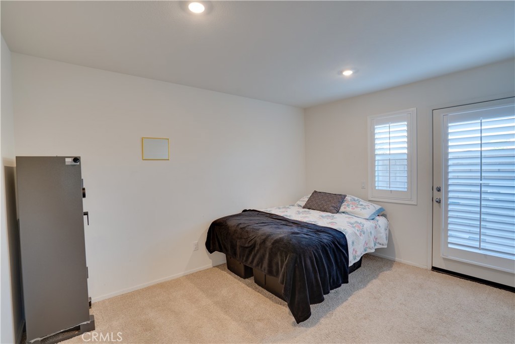 1328 Prosperity Place Hemet, CA 92543 - Photo 6 of 40 a bedroom with a bed and a refrigerator