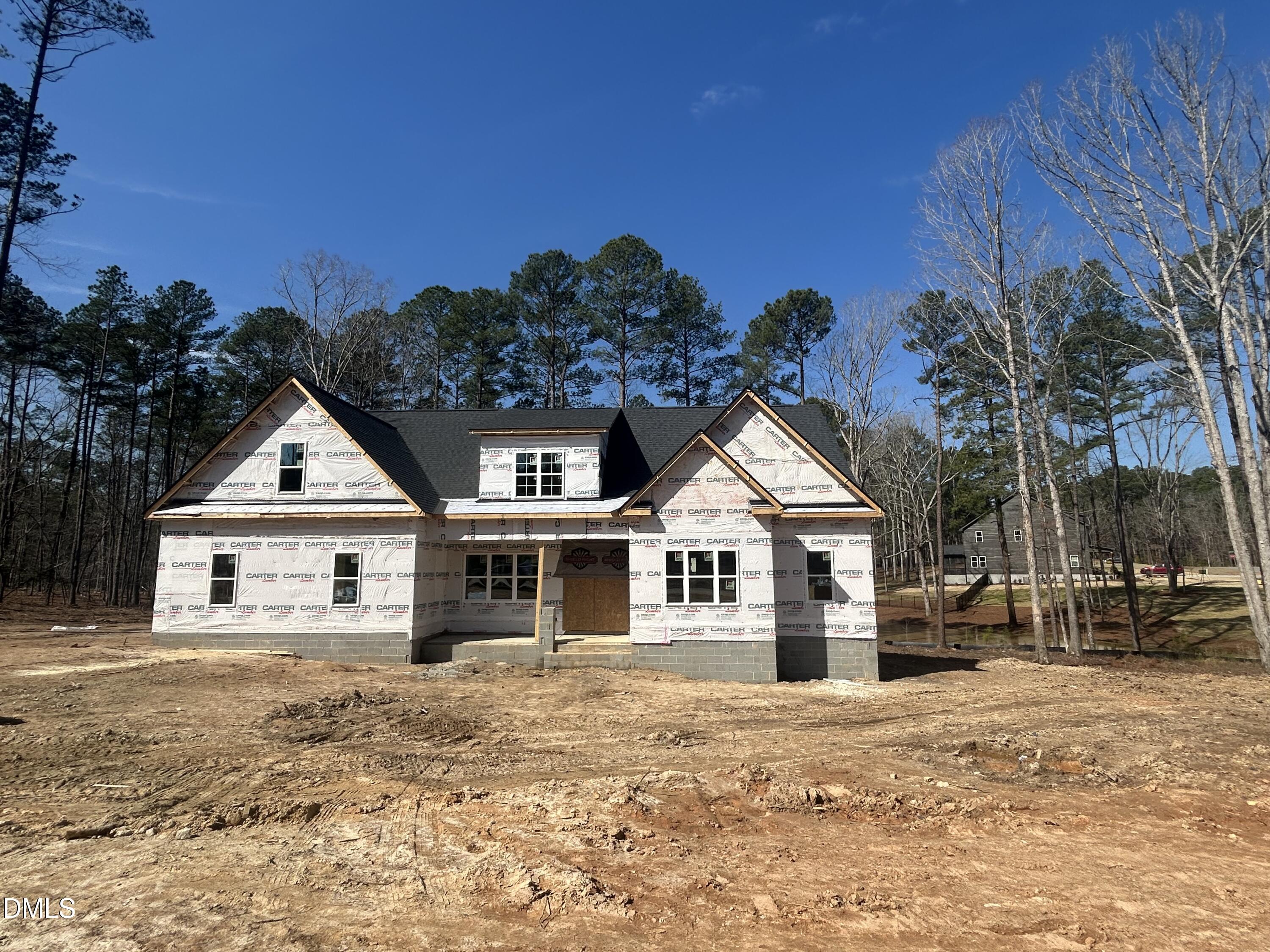 175 Landon Ridge Sanford, NC 27330 - Photo 1 of 20 a front view of a house with a garden