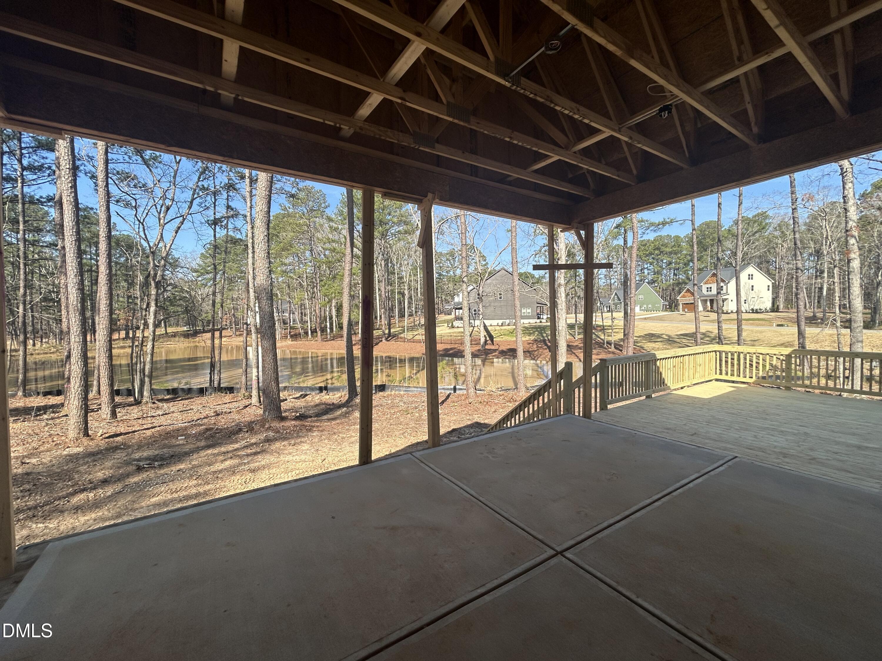 175 Landon Ridge Sanford, NC 27330 - Photo 11 of 20 a view of empty room with wooden floor and floor to ceiling window