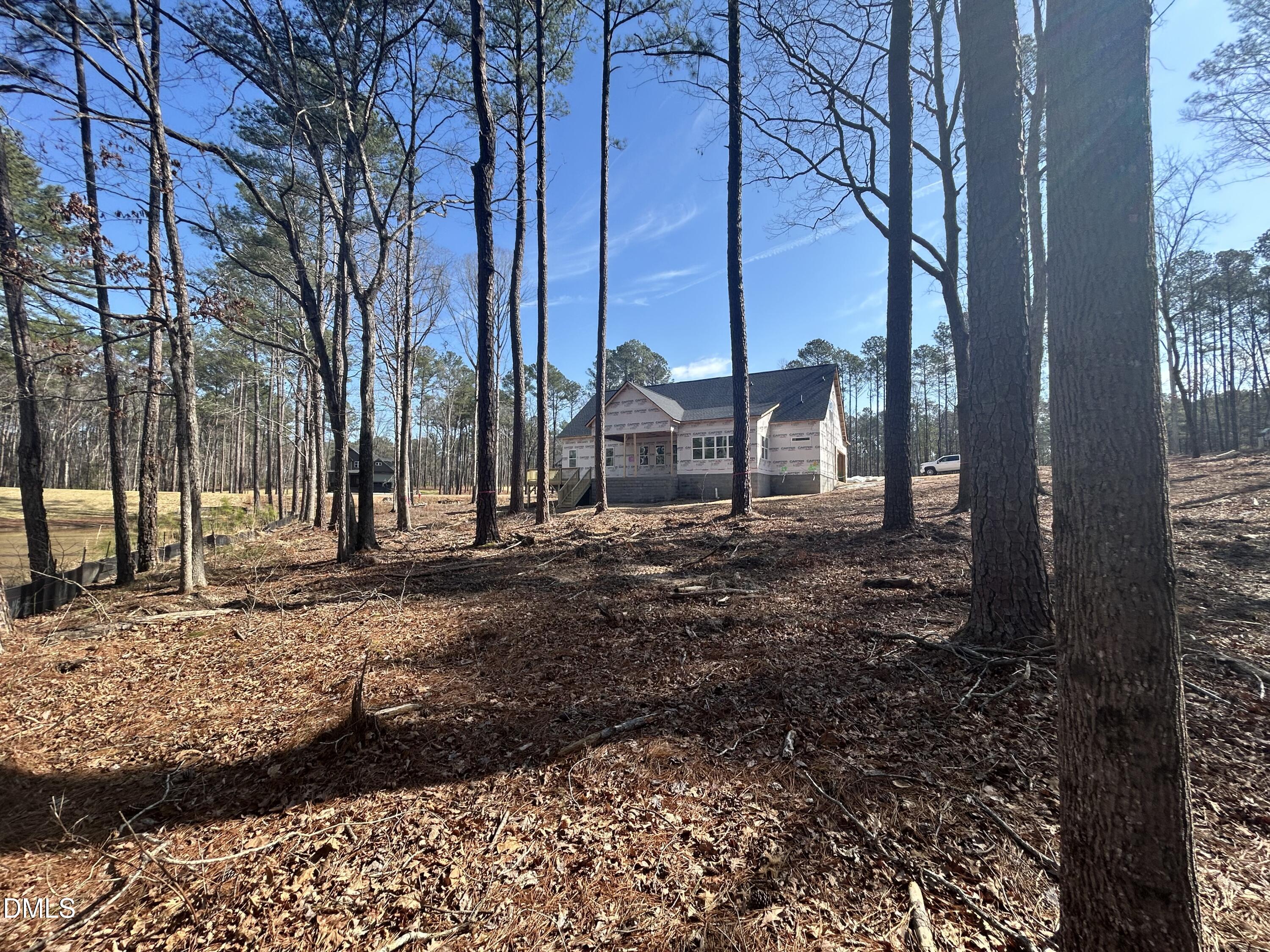 175 Landon Ridge Sanford, NC 27330 - Photo 13 of 20 a view of a large house with a yard and large tree