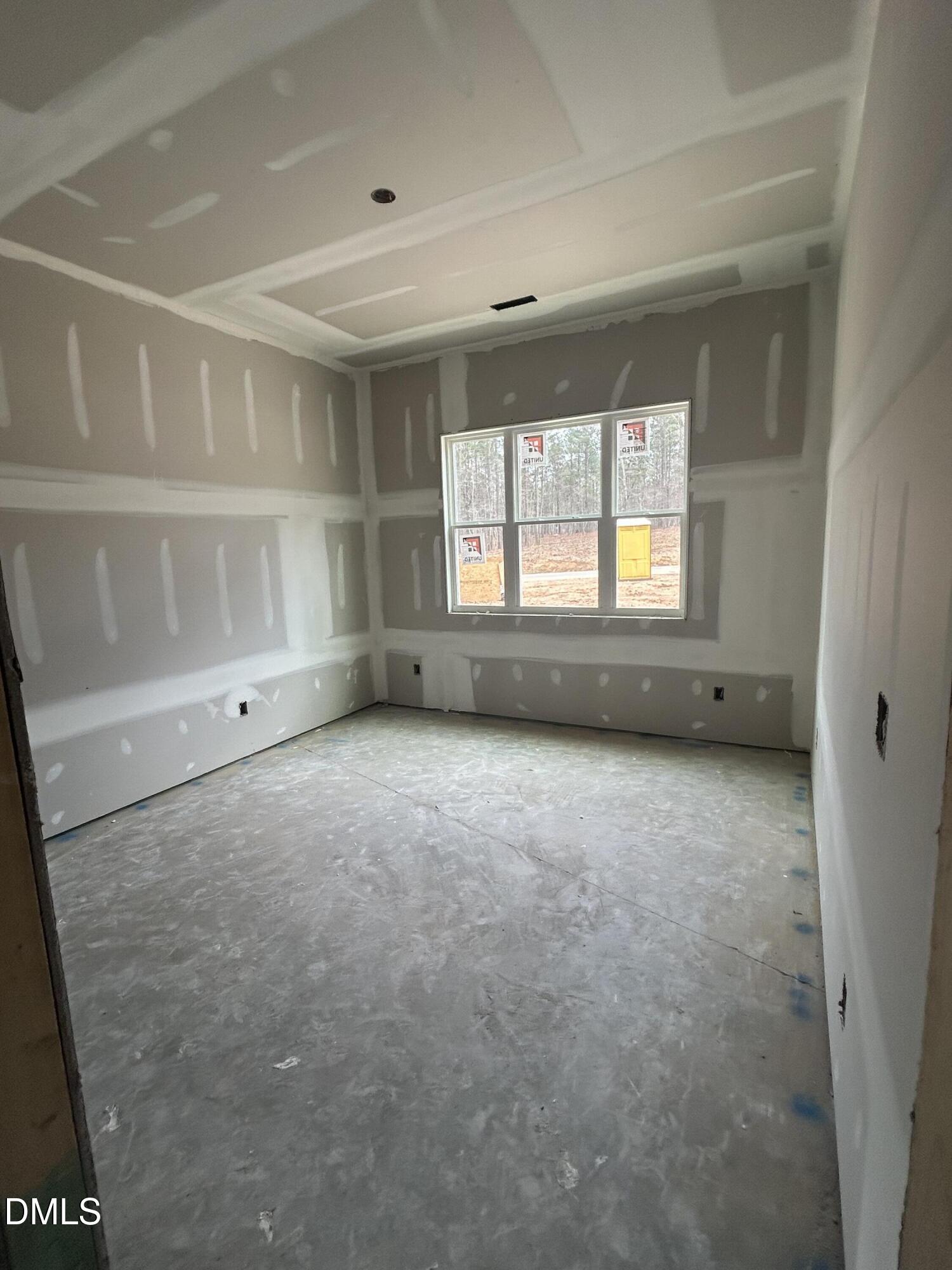 175 Landon Ridge Sanford, NC 27330 - Photo 7 of 20 an empty room with a empty space and windows