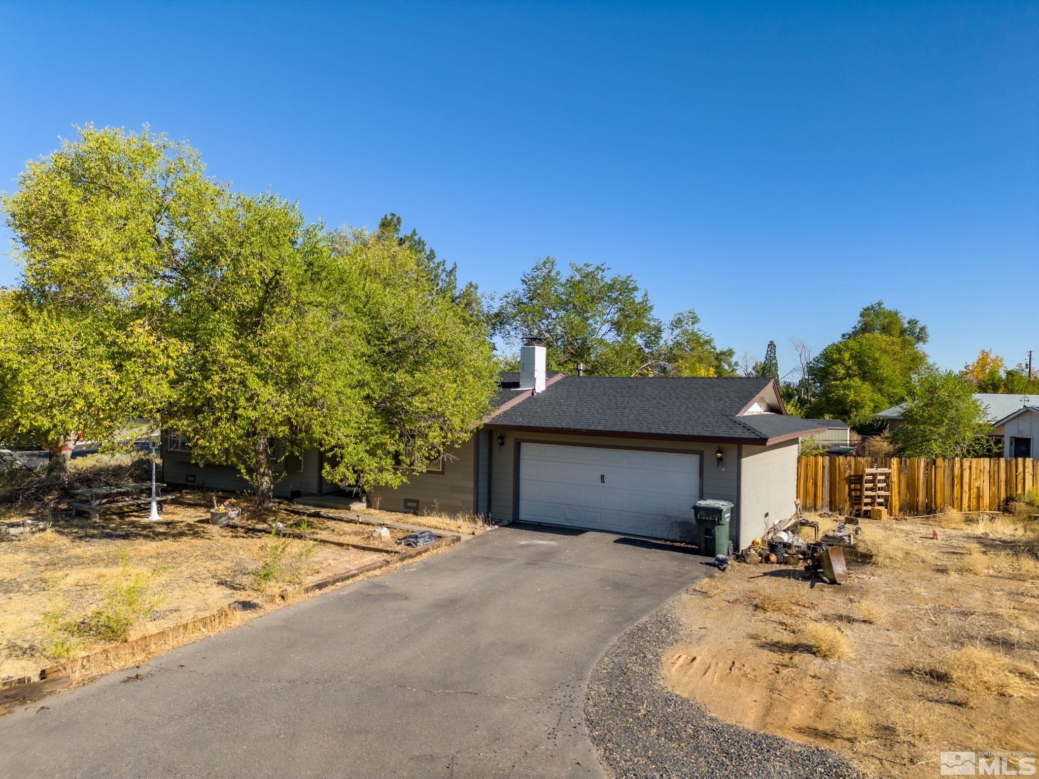1294 Manhattan Way Gardnerville, NV 89460 - Photo 1 of 27 a front view of a house with a yard