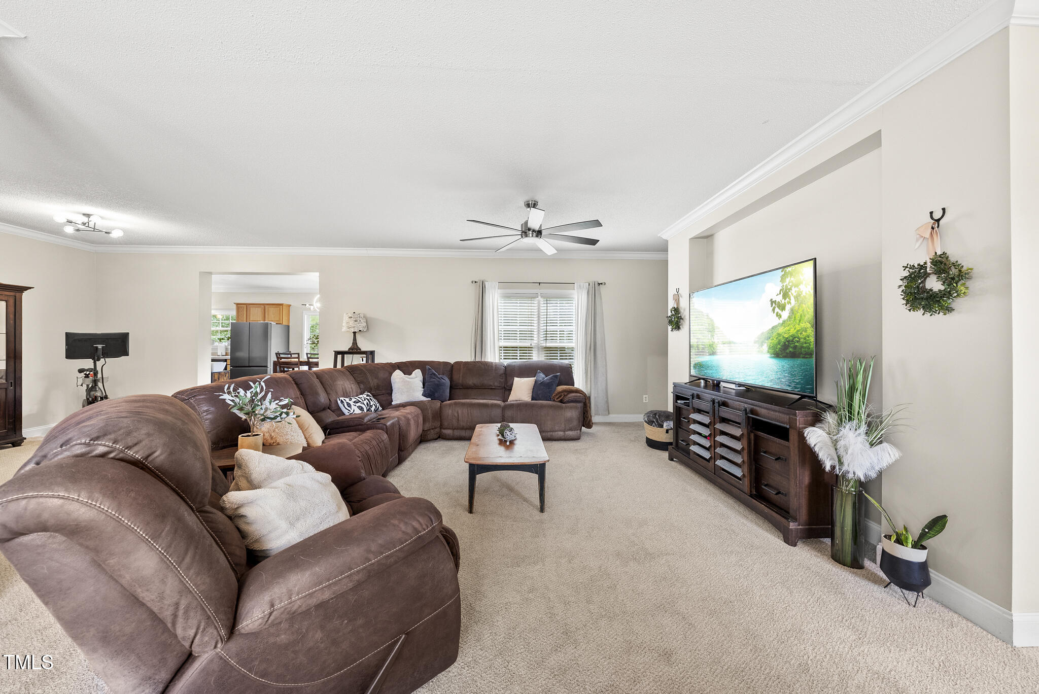 204 W Road Angier, NC 27501 - Photo 10 of 45 a living room with furniture and a flat screen tv