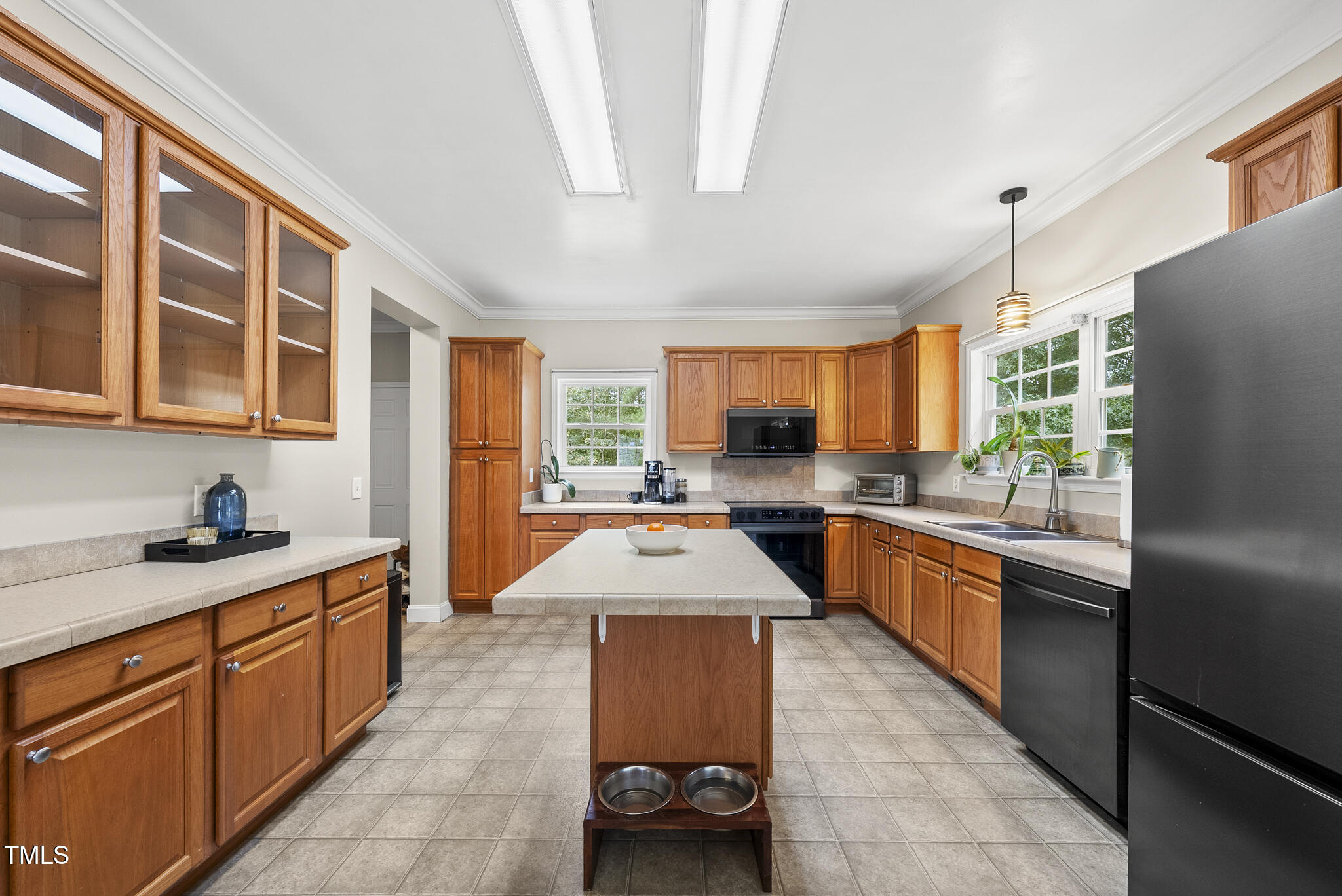 204 W Road Angier, NC 27501 - Photo 13 of 45 a kitchen with stainless steel appliances granite countertop sink stove and refrigerator