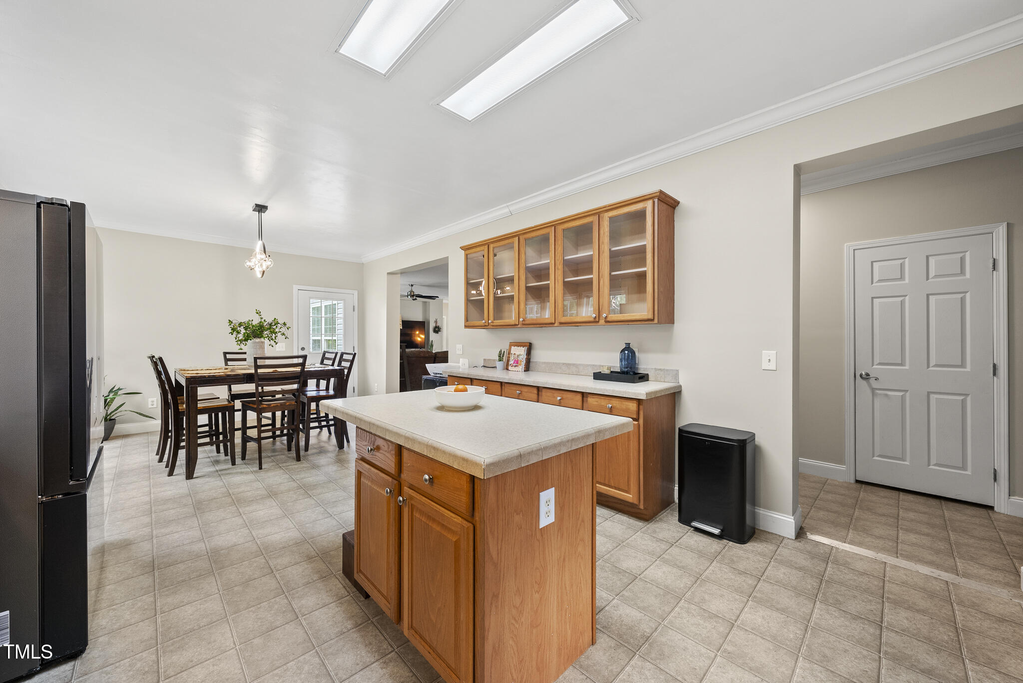 204 W Road Angier, NC 27501 - Photo 15 of 45 a kitchen with a stove a table and chairs