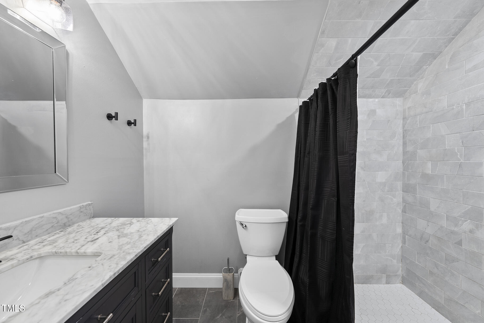 204 W Road Angier, NC 27501 - Photo 29 of 45 a bathroom with a granite countertop toilet sink and mirror