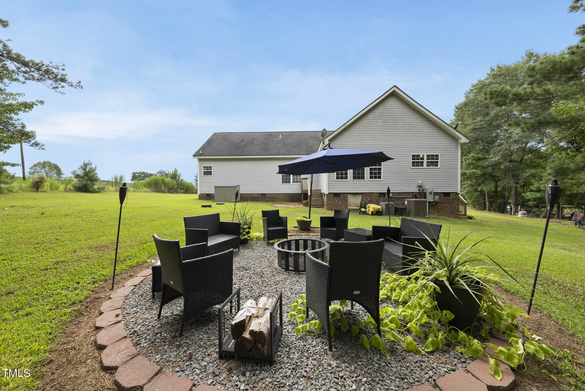 204 W Road Angier, NC 27501 - Photo 31 of 45 a view of a house with backyard sitting area and garden