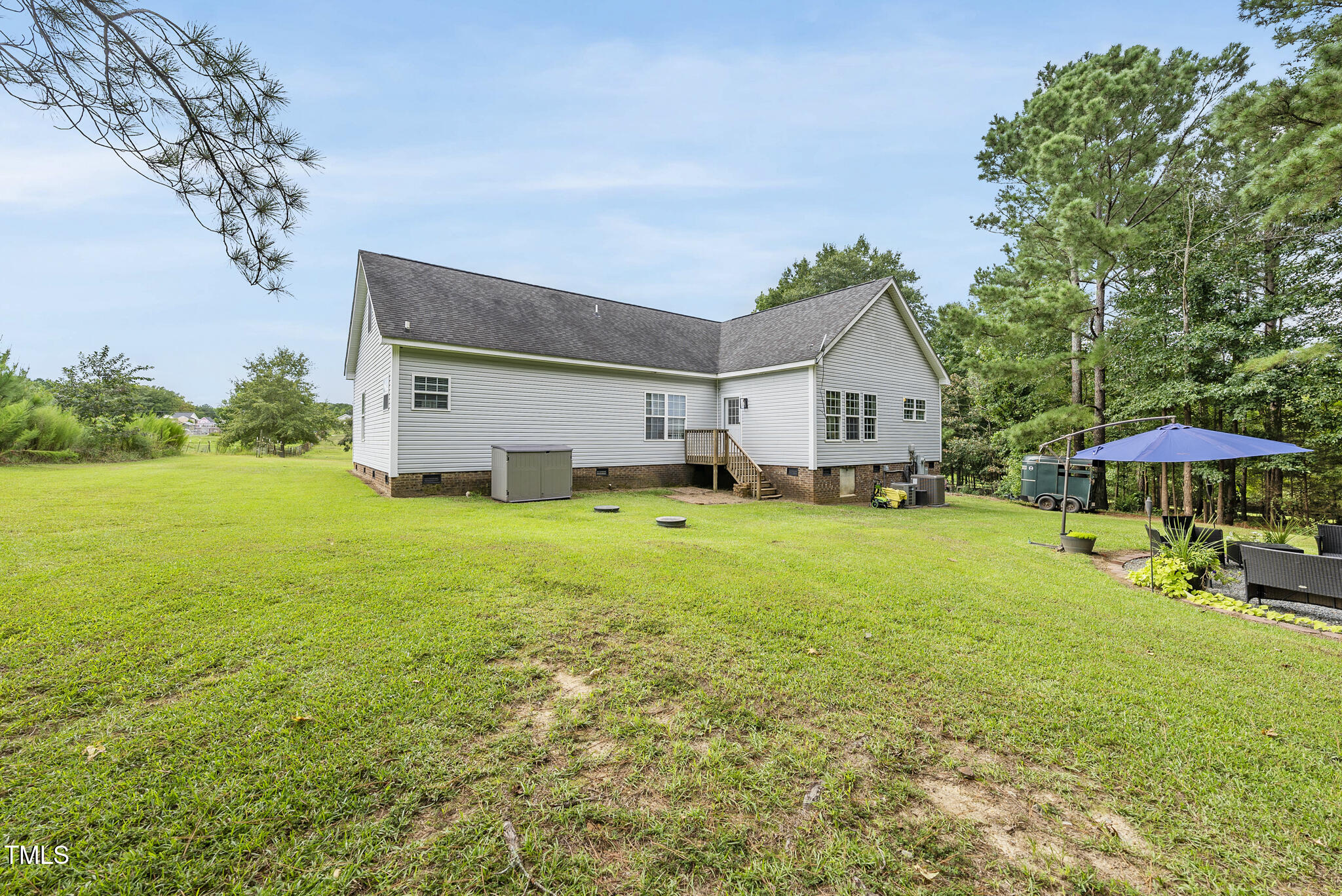 204 W Road Angier, NC 27501 - Photo 35 of 45 a house view with a garden space