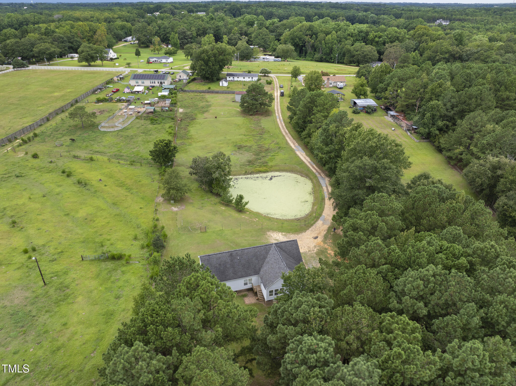 204 W Road Angier, NC 27501 - Photo 3 of 45 an aerial view of residential house with outdoor space and trees all around