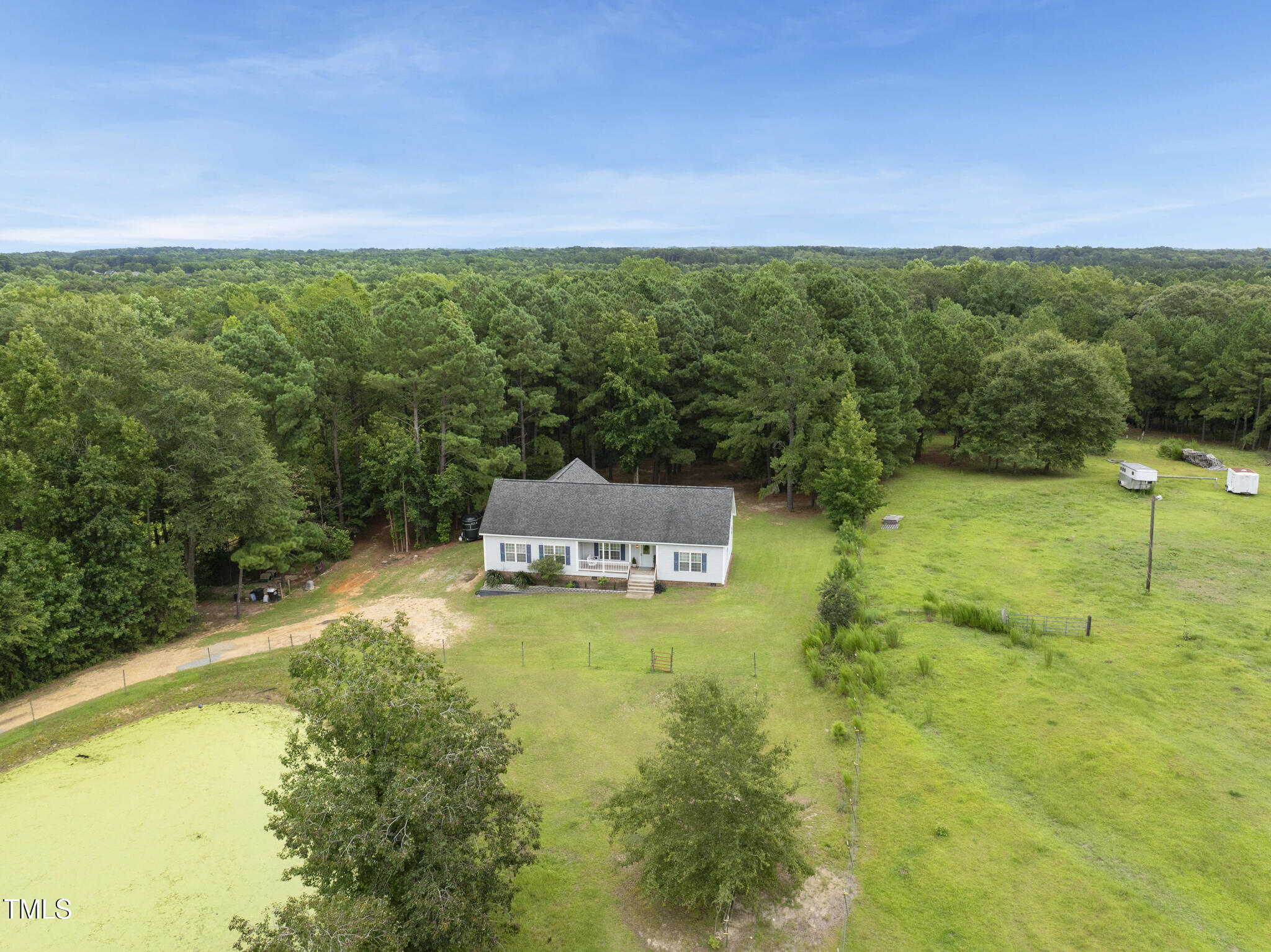 204 W Road Angier, NC 27501 - Photo 7 of 45 a view of a lake with a building in the background