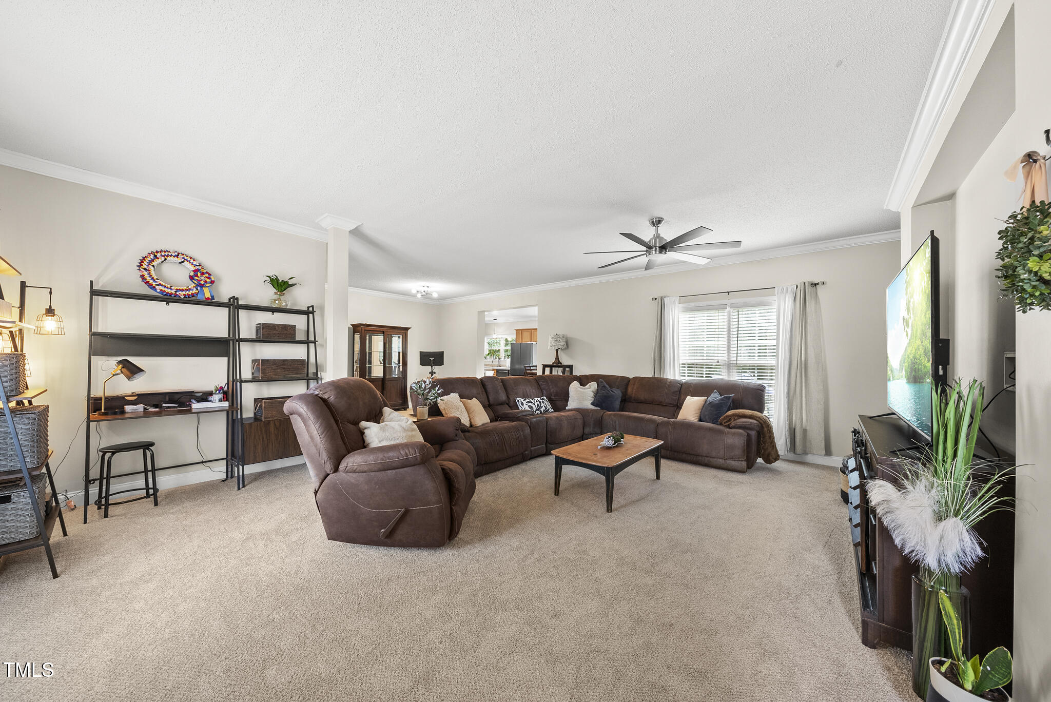 204 W Road Angier, NC 27501 - Photo 9 of 45 a living room with furniture and a flat screen tv