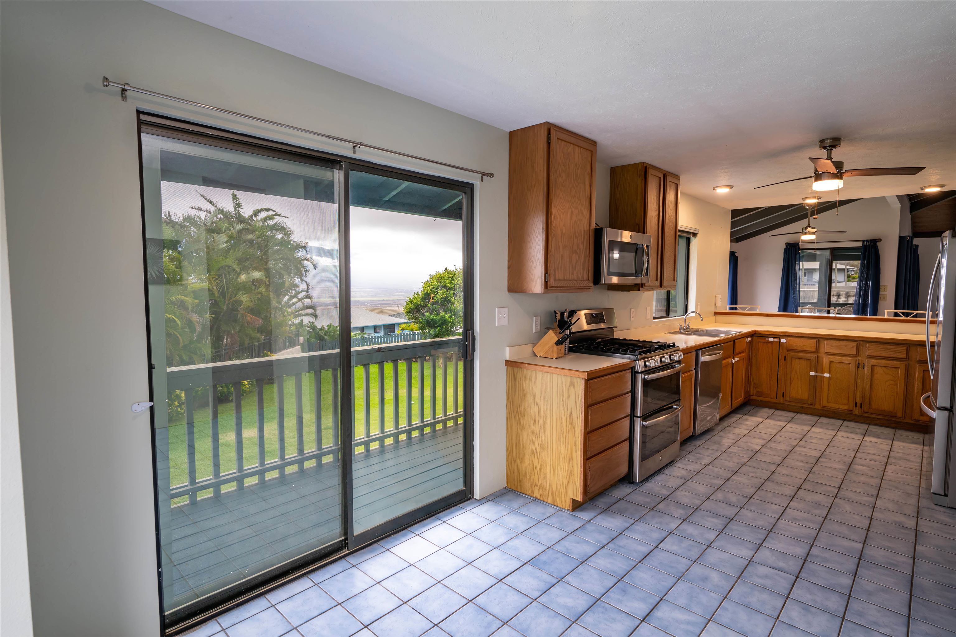 657 Mapuana Place Wailuku, HI 96793 - Photo 12 of 30 a kitchen with a sink a counter top space and cabinets