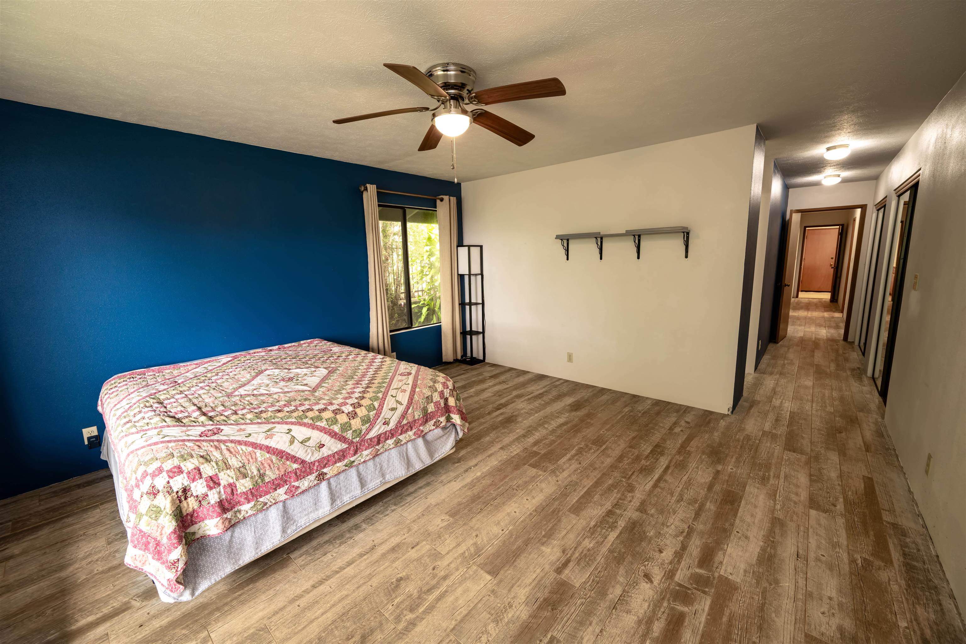 657 Mapuana Place Wailuku, HI 96793 - Photo 21 of 30 a bed sitting in a spacious bedroom next to a window