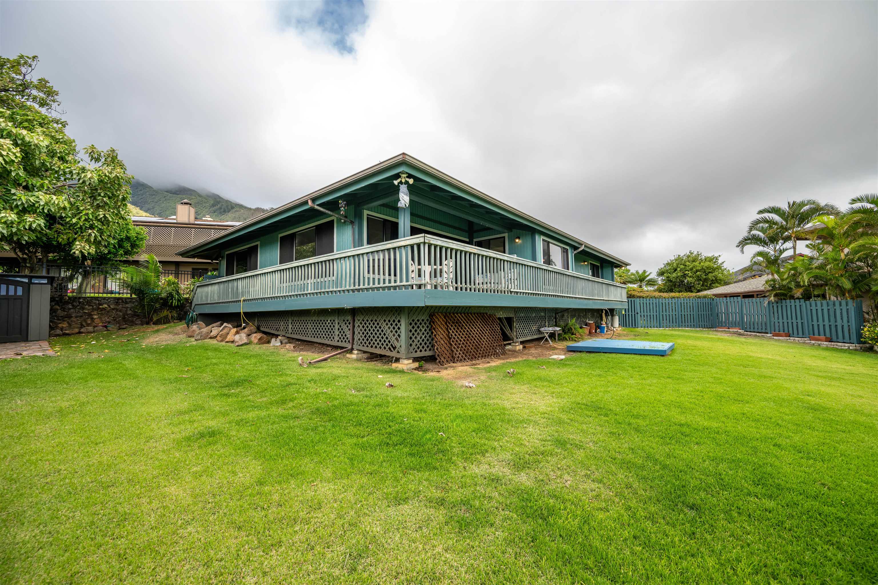 657 Mapuana Place Wailuku, HI 96793 - Photo 27 of 30 a front view of a house with a yard table and chairs
