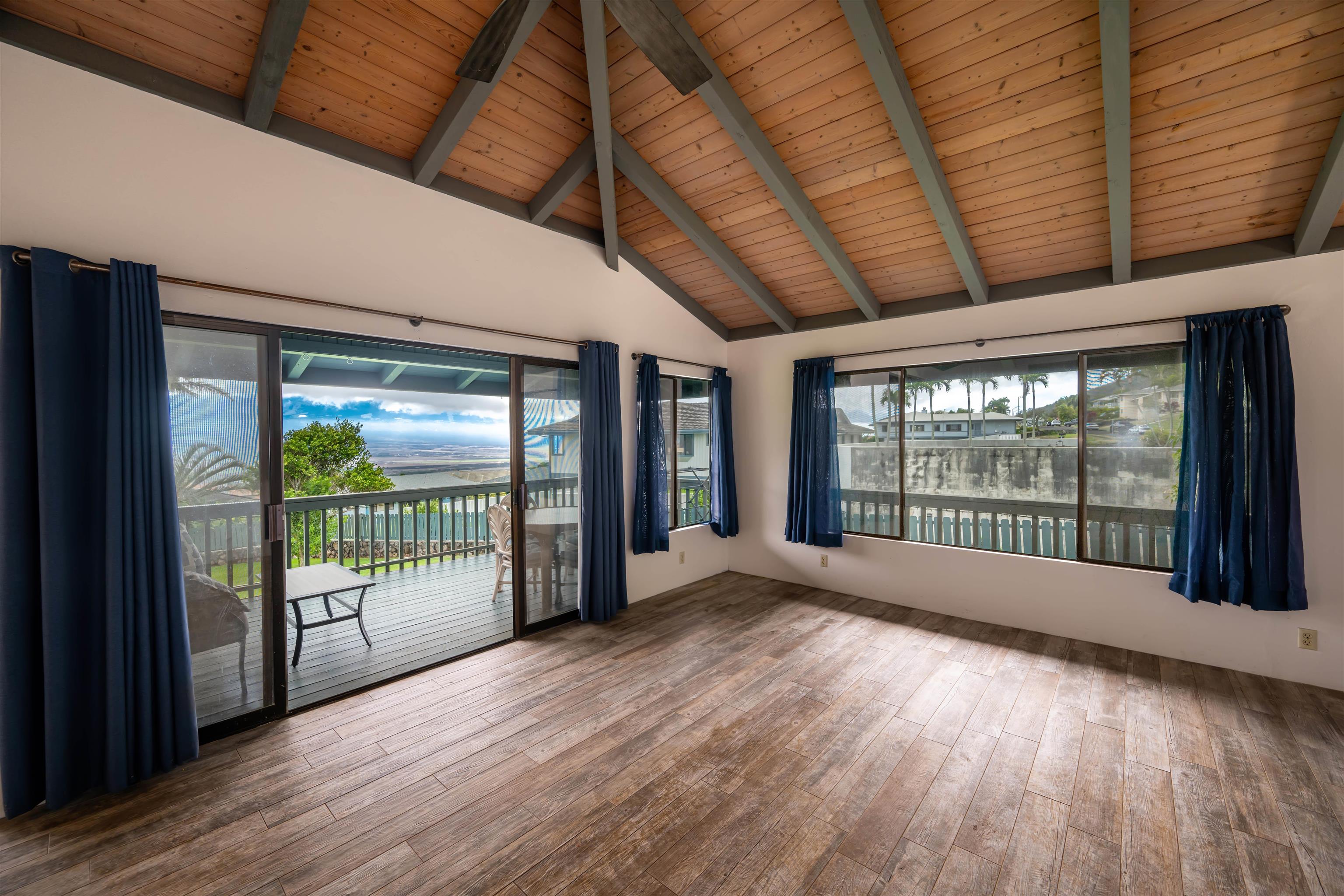 657 Mapuana Place Wailuku, HI 96793 - Photo 6 of 30 a view of an empty room with wooden floor and a window