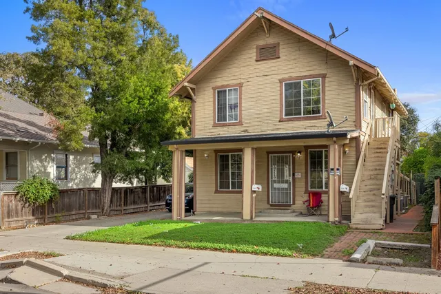 front view of a house with a yard