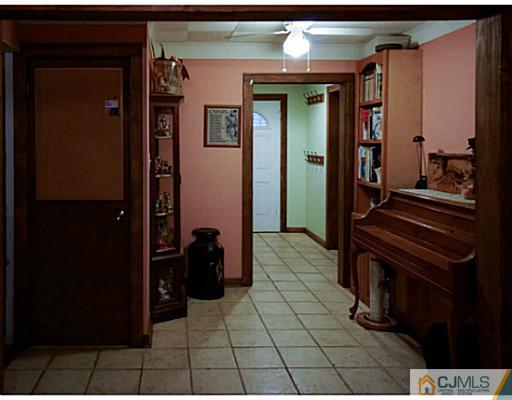 59 Utica Road Edison, NJ 08820 - Photo 4 of 6 a view of a hallway with wooden floor