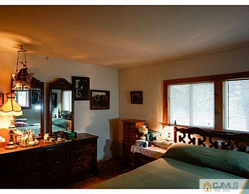 59 Utica Road Edison, NJ 08820 - Photo 6 of 6 a living room with furniture and a table