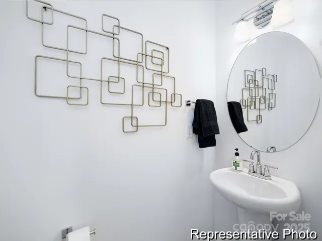 a bathroom with a sink and mirror