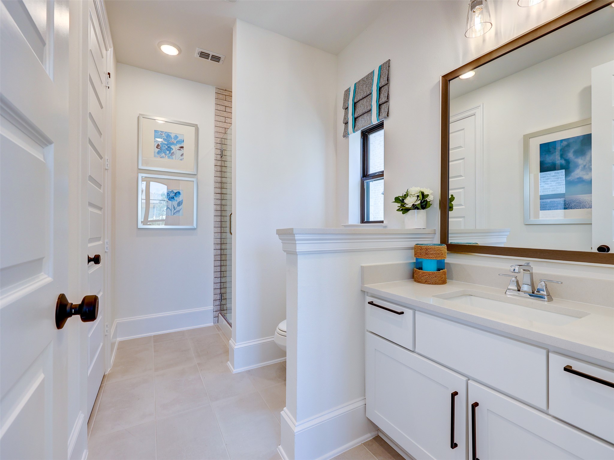 6220 Bower Well Road Austin, TX 78738 - Photo 16 of 28 A well-appointed bathroom with contemporary fixtures and a spacious walk-in shower.
