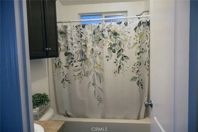 a bathroom with a bathtub and shower