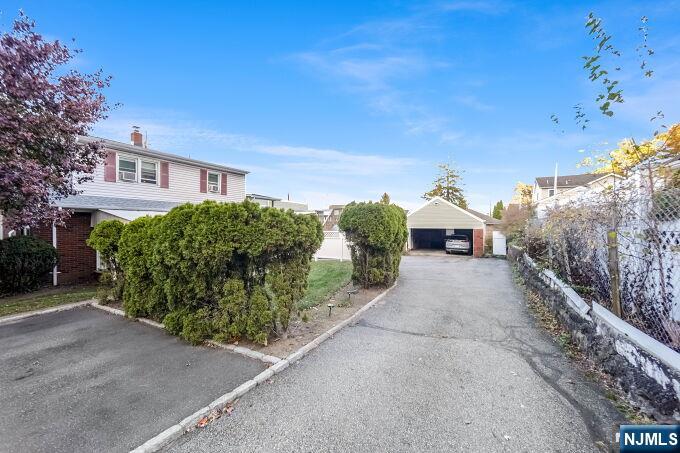 715 Main Street Caldwell, NJ 07006 - Photo 23 of 24 a pathway of a house with a yard