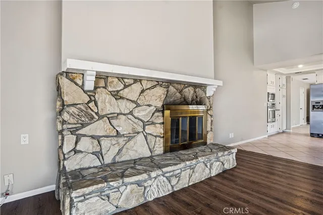 a living room with a couch and a floor to ceiling window